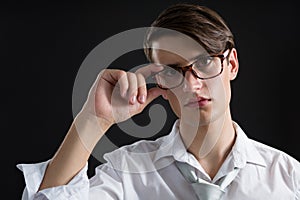 Androgynous man posing in spectacles photo