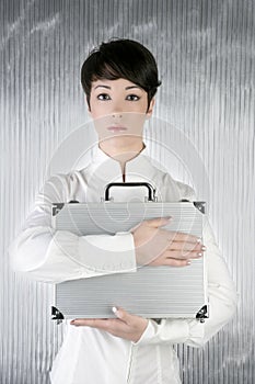 Androgynous woman holding silver briefcase photo