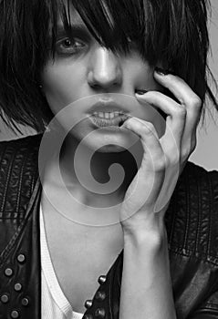 Androgyny female model in Heroin chic style. photo