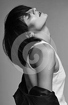 Androgyny female model in Heroin chic style. photo