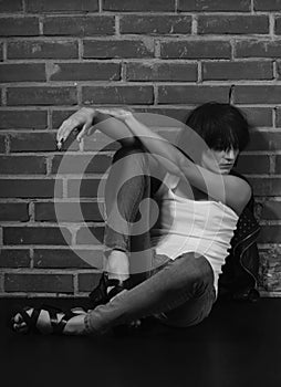 Androgyny female model in Heroin chic style. photo