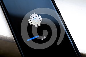 Android phone update installing, in progress, loading screen, smartphone display closeup. Updating mobile device firmware,