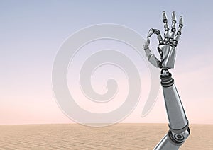 Android Robot hand gesture OK with desert sky background