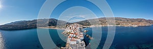 Andros Island, Greece. Chora town aerial panorama. Traditional buildings on cape