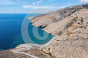 Andros island, Halkolimionas Beach Cyclades Greece. Aerial drone view of rocky mountain beach sea