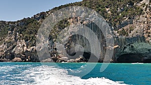 Andscape of Bue Marino Caves wth wild grass by the sea in Sardinia, Italy