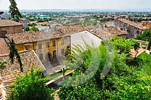 Andscape with roofs of houses in small tuscan town in province