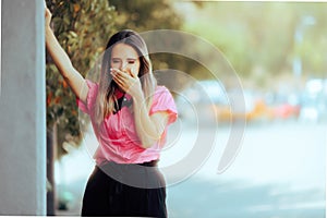 Businesswoman Feeling Sick in the middle of the Street. photo