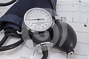Aneroid sphygmomanometer dial with normal physiological indicators of arterial pressure, bulb, air valve, cuff and black flexible