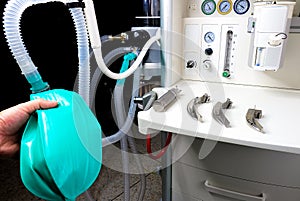 an anesthesiologist with an anesthetic machine photo