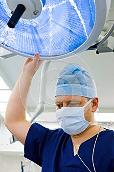 Anesthesiologist with surgical lamp photo