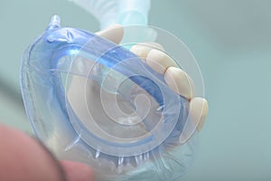 Anesthetic (oxygen) mask in front of the patient's face photo