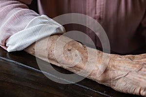 Anf elderly woman grandmother& x27;s arm with wrinkles and age spots.