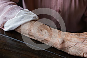 Anf elderly woman grandmother& x27;s arm with wrinkles and age spots. photo