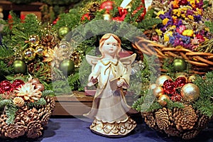 Angel on the background of Christmas tree branches photo