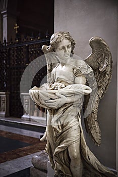 Angel. Baptismal font inside the church of St. Mary of the Angel
