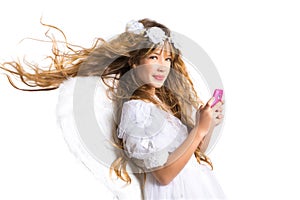 Angel blond girl with mobile phone and feather wings on white