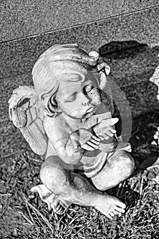 Angel Blowing Kisses at Headstone in Black and White