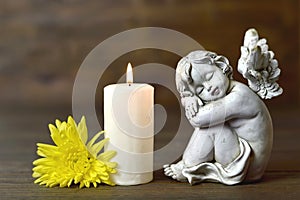 Angel, candle and flower