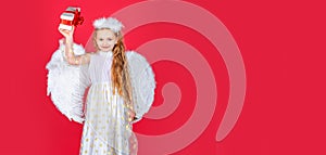 Angel child banner, isolated studio background. Child angel little girl with present gift, studio portrait. Little angel