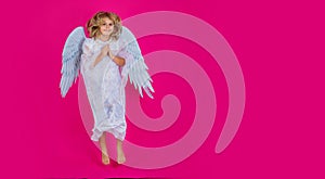 Angel child jump, kids jumping, full body in movement. Kid wearing angel costume white dress and feather wings. Banner