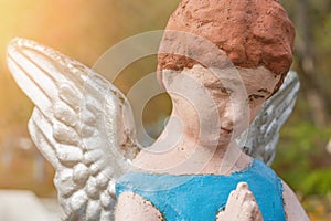 Angel child in prayer. concept: child loss, death of a child