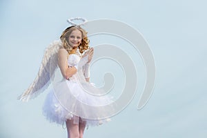 Angel children girl with white wings pray. Heaven. Teen angel. Valentine. Happy teenage angel girl pray. Festive Art