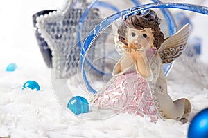 Angel christmas with blue ribbon at white background