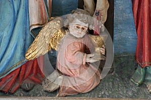 Angel collecting blood from the wounds of Christ