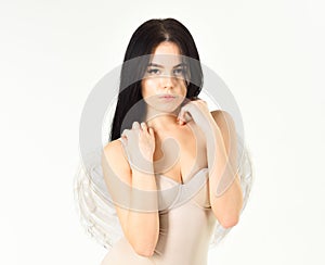 angel concept. Lady sexi dressed as angel, isolated on white. Angel girl with fluffy feather wings. Woman on