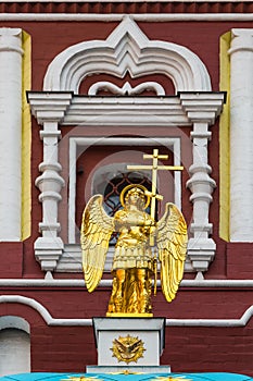 Angel with a cross on a chapel with a list of the Iberian Icon o