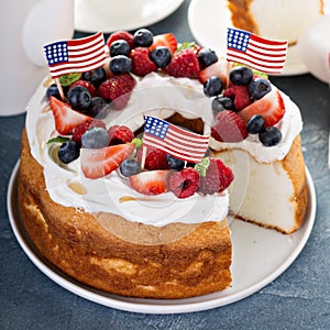 Angel food cake with whipped cream and berries