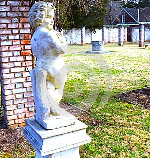 Angel of the Garden Stone Statue Oversees the Wintered Over Garden