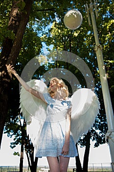 Angel girl with large white feather