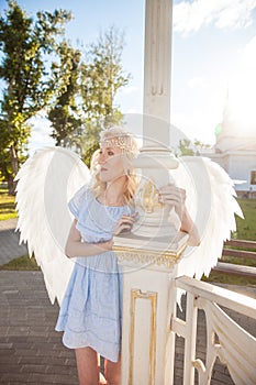 Angel girl with large white feather