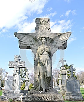 Angel guardian strong and protecting  cemetery headstone scene