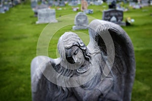 Angel Headstone In Graveyard Green Grass