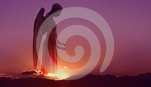 Angel in heaven over purple sky background photo