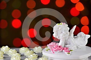 Angel of Love Cupid, Valentine's day and festive background of roses and bright lights.