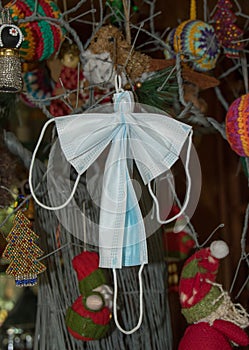 Angel made from covid-19 masks on a Xmas tree