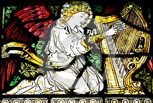 Angel making music (stained glass)