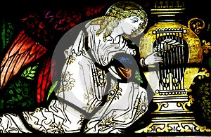 Angel making music (stained glass)