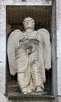 Angel, marble statue on the Baptistery, Parma, Italy