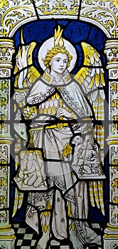 Angel Michael weighing the souls in stained glass