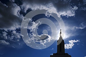 Angel Moroni on Top of Mormon LDS Temple with Sky and Clouds photo