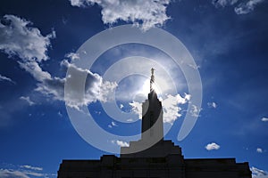 Angel Moroni on Top of Mormon LDS Temple with Sky and Clouds photo