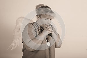 Angel praying nurse