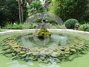 Romantic Fountain in a Garden in Europe photo