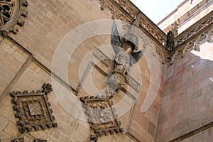 Angel relief sculpture on stone wall on church in Barcelona