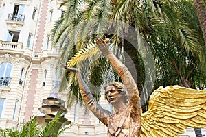 The angel sculpture with golden palm in Cannes